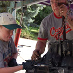 Papa and grandson Jonah working on a race car motor!